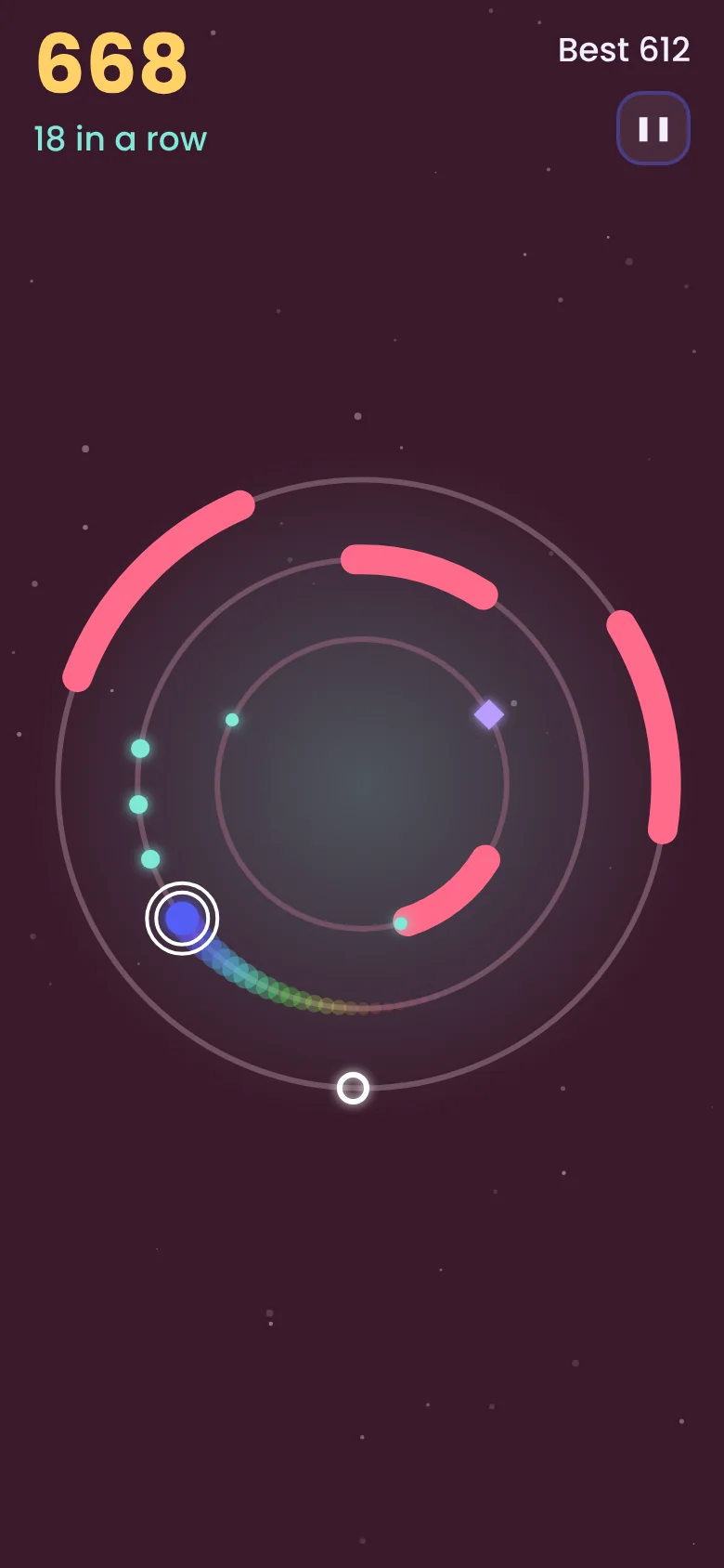 Orbit Hop gameplay in the Ember zone with a rainbow comet trail
